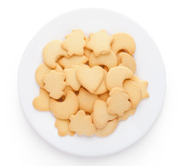 cookies with different shapes on plate isolated on white backgro
