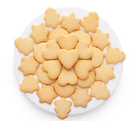 cookies with different shapes on plate isolated on white backgro