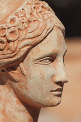 Obraz premium beautiful terracotta female face profile, Italy