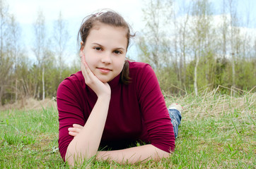 Portrait of the girl against the blue sky