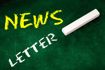 newsletter on green chalkboard