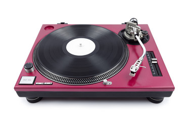A wide angle shot of a cherry red turntable from above