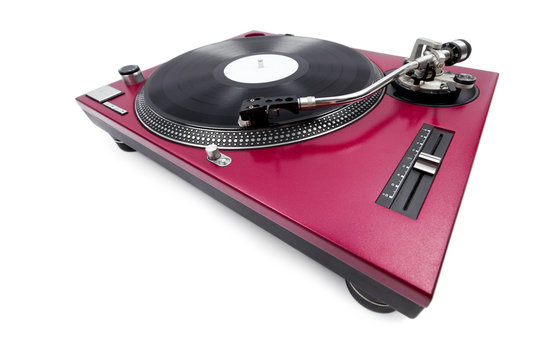 A wide angle shot of a cherry red turntable from the pitch side