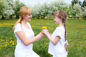 girl with mother in spring park