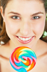 Teenager girl with lollipop