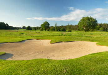Fototapeta na wymiar Idyllic golf course with sand banks