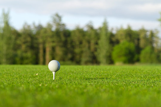 Golf ball on the tee - idyllic golf course of Adare