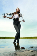 Cute young woman on the marshland