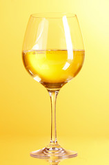 wine glass on yellow background