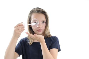 Naklejka premium smiling girl creating bubble