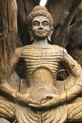 Fototapeta na wymiar Wooden buddha statue