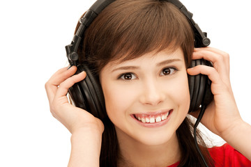 Fototapeta premium happy teenage girl in big headphones