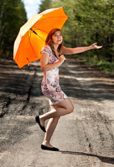 beautiful girl with an orange umbrella