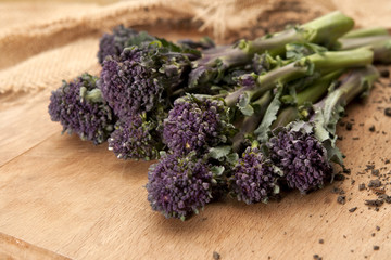 Purple Broccoli on wooden board