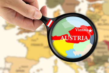 Magnifying glass over a map of Austria