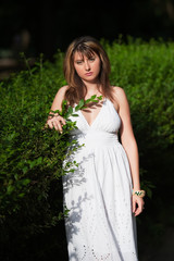 portrait of a beautiful young girl in a park.