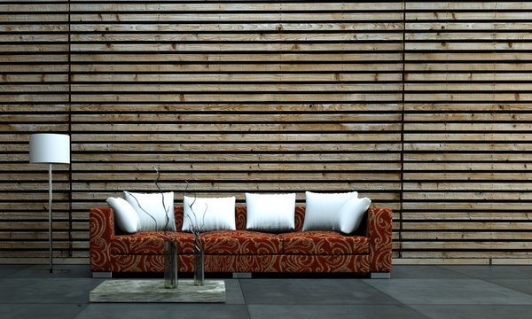 Rotes Sofa cor Holzwand mit weissen Kissen