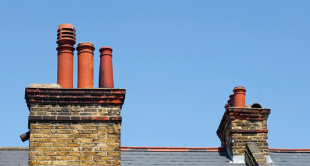 Chimney stacks on the roof of a victorian terrace house