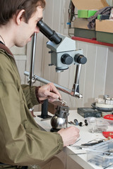 jeweller  working with  microscope