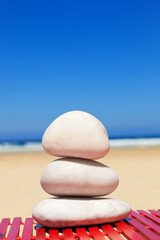 Balance stones in a deserted beach at summer