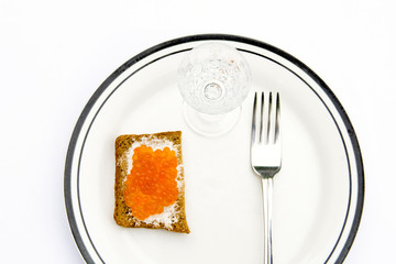 Rye bread with red caviar  on a plate