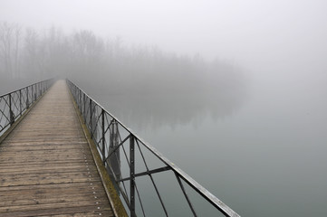 pedestiran bridge in fog, adda river