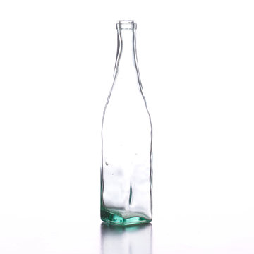 Clear glass bottle standing alone isolated on white