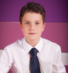 Young adolescent dressed in business clothes