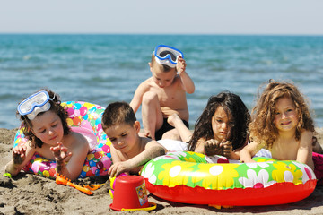 Obraz premium child group have fun and play with beach toys