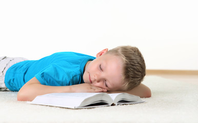 little boy with a book in studio