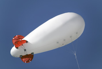 Advertising balloon  in he sky © Mikael Damkier