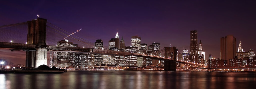 Brooklyn Bridge city scape in NYC. Night in Manhattan, beautiful calm scene of New York City.