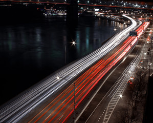 FDR in NYC, Light trails on road around Manhattan. Traffic jam in New York City at night passing under Brooklyn bridge. Beautiful NYC night Cityscape 