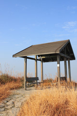 pavilion on the grassland with blue sky.
