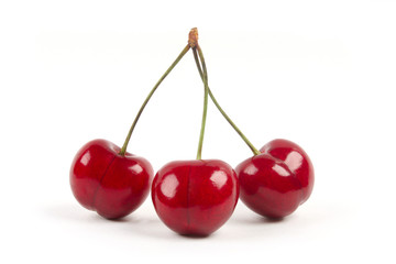 Red cherries isolated on a white background