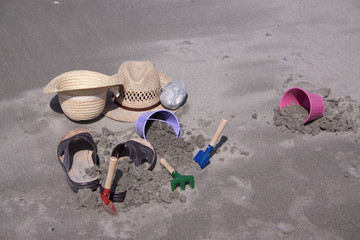 Fototapeta na wymiar Toy-buckets in the sand on the beach