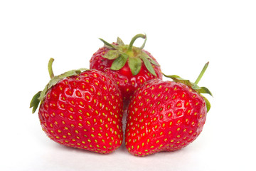 Ripe strawberries on a white background