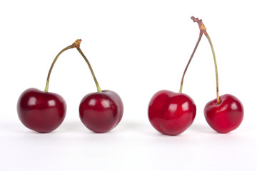 Fototapeta na wymiar Red cherries isolated on a white background