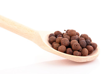 Spices in spoon isolated on white