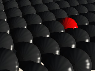black umbrellas with one  red umbrella