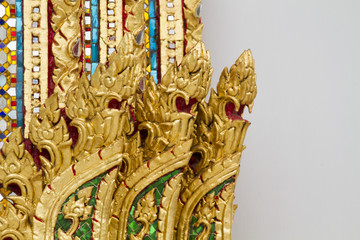 golden flower and colorful mosaic in buddha temple building