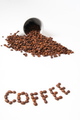 Coffe beans with a mug on white background