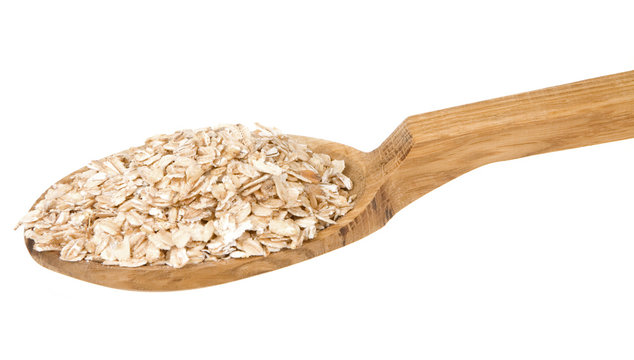 oatmeal cereals in spoon isolated on whit