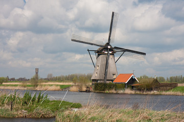 Fototapeta na wymiar Old historic windmill in the Netherlands