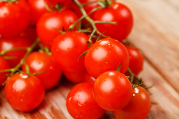 Cherry tomatoes on the wood background