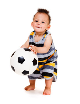 Baby holding  ball