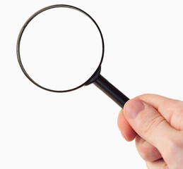 Hand holding a magnifying glass