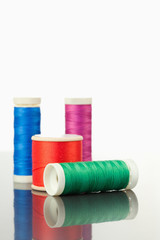 Colorful spools of thread on a table