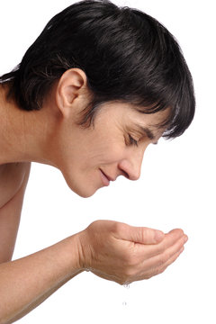 Mature Woman Washing Her Face