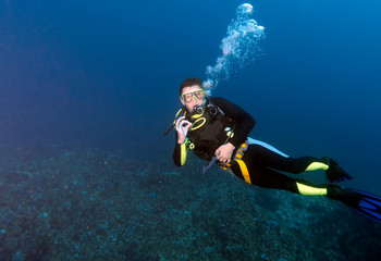 Diver, showing ok sign